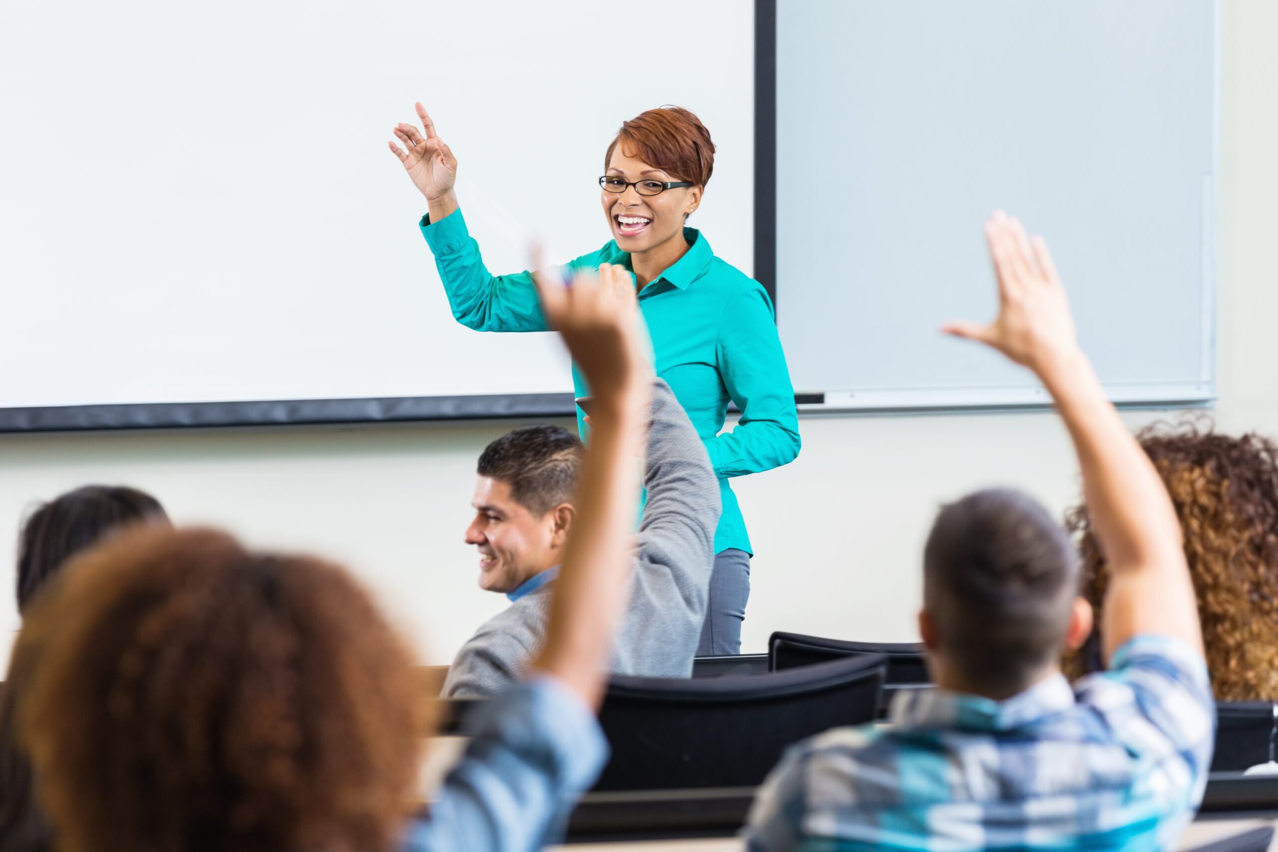 instructor in front of class of adults